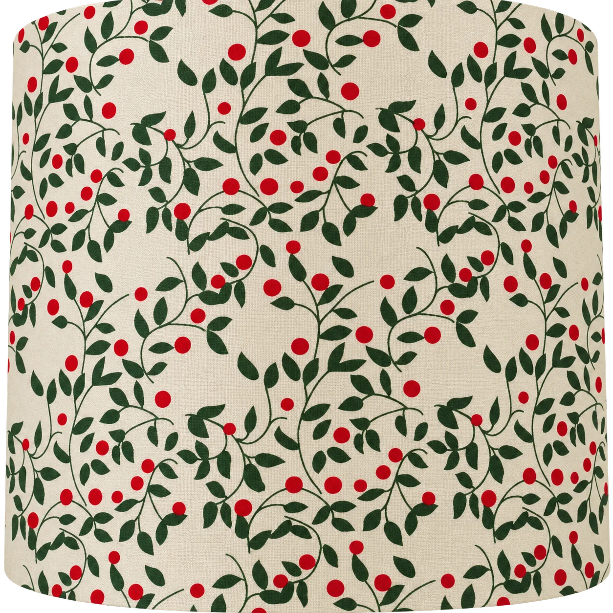 Gros plan sur un tissu beige imprimé de fines branches vertes garnies de feuilles et de petites baies rouges.